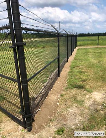 Commercial grade vinyl chain-link fence with barbed wire