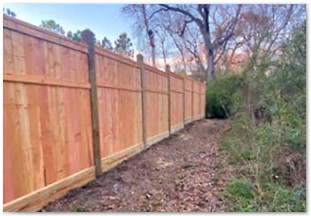 Eight foot capped and trimmed western red cedar fence with 6x6 posts