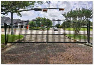 Wrought iron double drive gate with arch