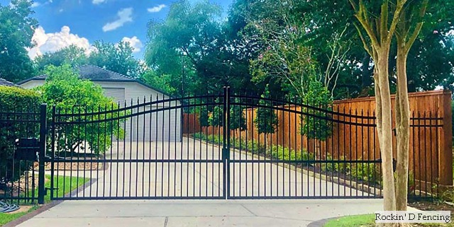 7ft Capped western red cedar fence (stained), 5ft wrought iron fence and double drive wrought iron gate with arch