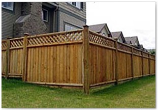 Red Cedar privacy fencing with rot board, decorative post caps and lattice top